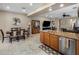 Open kitchen overlooking dining area with stainless steel appliances and granite countertops at 4230 W Palace Station Rd, New River, AZ 85087