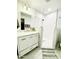Updated bathroom with glass shower, marble vanity, and modern fixtures at 541 W Marlette Ave, Phoenix, AZ 85013