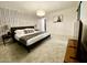 Stylish bedroom with patterned wallpaper, tv and comfortable modern bed at 541 W Marlette Ave, Phoenix, AZ 85013