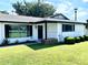 A charming home with fresh landscaping, including well-placed shrubbery and a bright green lawn at 541 W Marlette Ave, Phoenix, AZ 85013