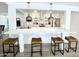 Open concept kitchen featuring an island with seating and modern pendant lighting at 541 W Marlette Ave, Phoenix, AZ 85013