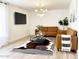 Inviting living room with stylish leather furniture and a modern light fixture at 541 W Marlette Ave, Phoenix, AZ 85013