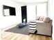 Cozy living room with comfortable seating, stylish rug, and modern decor at 541 W Marlette Ave, Phoenix, AZ 85013