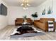 Inviting living room with stylish leather furniture and a modern light fixture at 541 W Marlette Ave, Phoenix, AZ 85013