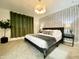 Modern main bedroom featuring a plush bed, stylish wallpaper, elegant lighting, and decorative accents at 541 W Marlette Ave, Phoenix, AZ 85013