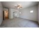 Bright bedroom with an ensuite and mirrored closet at 5418 W Carson Rd, Laveen, AZ 85339