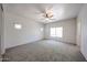 Neutral bedroom featuring a ceiling fan and natural light at 5418 W Carson Rd, Laveen, AZ 85339