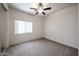 Comfortable bedroom with a ceiling fan and a window at 5418 W Carson Rd, Laveen, AZ 85339