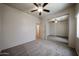 Bedroom with a mirrored closet and neutral carpet at 5418 W Carson Rd, Laveen, AZ 85339
