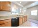 Kitchen featuring a dishwasher, sink, and view into the Gathering room at 5418 W Carson Rd, Laveen, AZ 85339