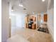 Kitchen featuring tile floors and cabinets with black appliances at 5418 W Carson Rd, Laveen, AZ 85339