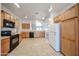 Kitchen featuring tile floors, cabinets and black appliances at 5418 W Carson Rd, Laveen, AZ 85339