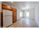 Eat in kitchen with cabinets and view of the carpeted living room at 5418 W Carson Rd, Laveen, AZ 85339