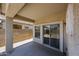 Covered patio with view into backyard and sliding glass doors for indoor/outdoor living at 5418 W Carson Rd, Laveen, AZ 85339