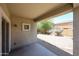 Covered patio overlooking a well-maintained backyard with mature landscaping at 5418 W Carson Rd, Laveen, AZ 85339