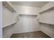 Walk-in closet with ample shelving and carpet at 5418 W Carson Rd, Laveen, AZ 85339