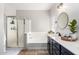 Modern bathroom with a separate shower, soaking tub, dual sinks, and stylish fixtures at 6317 S Banning St, Gilbert, AZ 85298