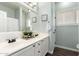 Bathroom with double sink vanity, framed mirror, and decorative accents at 6317 S Banning St, Gilbert, AZ 85298