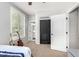 Comfortable bedroom with closet access, a guitar, and natural lighting at 6317 S Banning St, Gilbert, AZ 85298