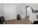 Bedroom featuring closet, doorway to bathroom, and exercise equipment at 6317 S Banning St, Gilbert, AZ 85298