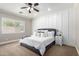 Inviting bedroom featuring a plush bed, stylish decor, and abundant natural light at 6317 S Banning St, Gilbert, AZ 85298