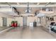 Organized garage with storage shelves, work space, and epoxy flooring at 6317 S Banning St, Gilbert, AZ 85298
