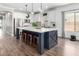 Open kitchen design with a large island, stainless steel appliances, and ample cabinet space at 6317 S Banning St, Gilbert, AZ 85298