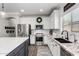 Bright kitchen featuring stainless steel appliances, granite countertops, and ample storage at 6317 S Banning St, Gilbert, AZ 85298