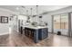 Spacious kitchen with a large center island, stainless steel appliances, and white cabinetry at 6317 S Banning St, Gilbert, AZ 85298