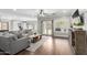 Bright living room featuring hardwood floors, modern furnishings, and access to the backyard at 6317 S Banning St, Gilbert, AZ 85298