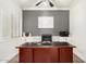 A dedicated home office space with custom built-ins, a large desk, and ample natural light at 6317 S Banning St, Gilbert, AZ 85298