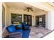 Covered patio with comfortable seating, ceiling fan, and stylish decor at 6317 S Banning St, Gilbert, AZ 85298