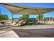 Playground featuring covered area with slides and climbing structures at 6317 S Banning St, Gilbert, AZ 85298