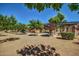 Community playground with modern play structures and shade at 6317 S Banning St, Gilbert, AZ 85298