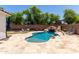 Inviting pool with water slide, rock accents, and spacious deck at 6317 S Banning St, Gilbert, AZ 85298