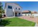 Landscaped backyard featuring artificial turf and a covered patio at 742 W Vineyard Plains Dr, San Tan Valley, AZ 85143