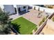 Well-designed backyard with artificial turf, patio, and landscaping at 742 W Vineyard Plains Dr, San Tan Valley, AZ 85143