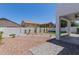 Well-maintained backyard featuring stone landscaping and artificial turf at 742 W Vineyard Plains Dr, San Tan Valley, AZ 85143