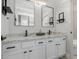 Bathroom features double sinks, granite counters, sleek black fixtures, and modern vanity at 742 W Vineyard Plains Dr, San Tan Valley, AZ 85143