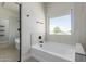 Bright bathroom featuring a soaking tub, shower, and modern fixtures at 742 W Vineyard Plains Dr, San Tan Valley, AZ 85143
