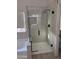 Contemporary bathroom showcasing a glass-enclosed shower with matte black fixtures at 742 W Vineyard Plains Dr, San Tan Valley, AZ 85143