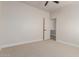 Bright bedroom with view to another room, neutral paint and carpet at 742 W Vineyard Plains Dr, San Tan Valley, AZ 85143