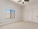 Bright bedroom with closet, neutral paint and carpet, and view to roofline outside window at 742 W Vineyard Plains Dr, San Tan Valley, AZ 85143