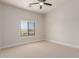 Bright bedroom with a view to trees outside the window, neutral paint and carpet at 742 W Vineyard Plains Dr, San Tan Valley, AZ 85143