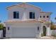 Inviting two-story home featuring a neutral-colored exterior, arched entryway, and a spacious two-car garage at 742 W Vineyard Plains Dr, San Tan Valley, AZ 85143