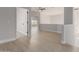 Bright hallway featuring wood floors, neutral paint, and view to window at 742 W Vineyard Plains Dr, San Tan Valley, AZ 85143