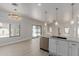 Spacious kitchen featuring granite countertops, stainless steel appliances, and backyard access at 742 W Vineyard Plains Dr, San Tan Valley, AZ 85143