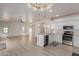 Bright, open concept kitchen with stainless steel appliances and a stylish chandelier at 742 W Vineyard Plains Dr, San Tan Valley, AZ 85143