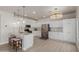 Gourmet kitchen featuring white cabinets, quartz countertops, and stainless steel appliances at 742 W Vineyard Plains Dr, San Tan Valley, AZ 85143