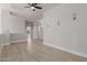 Spacious living room with light-colored wood floors and a modern ceiling fan at 742 W Vineyard Plains Dr, San Tan Valley, AZ 85143